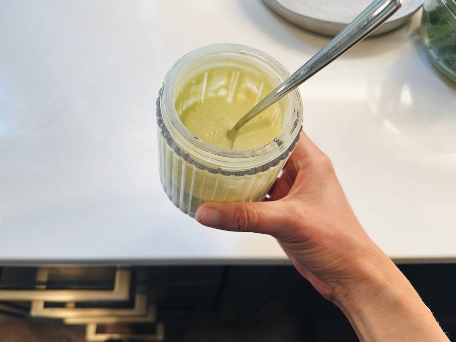 Avocado caesar dressing in a jar.