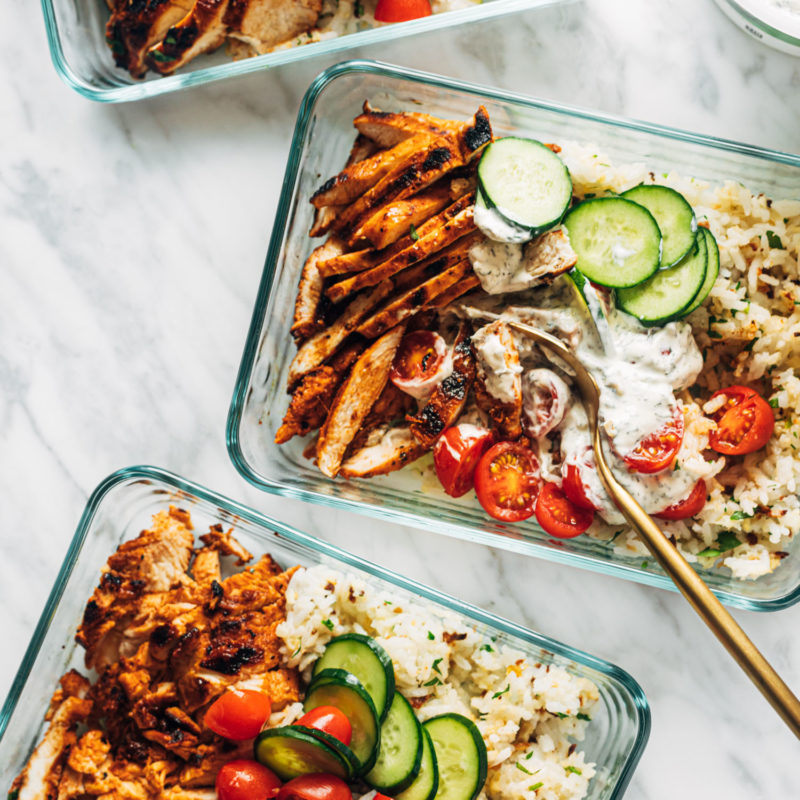 Buffalo chicken bowls in meal prep containers.