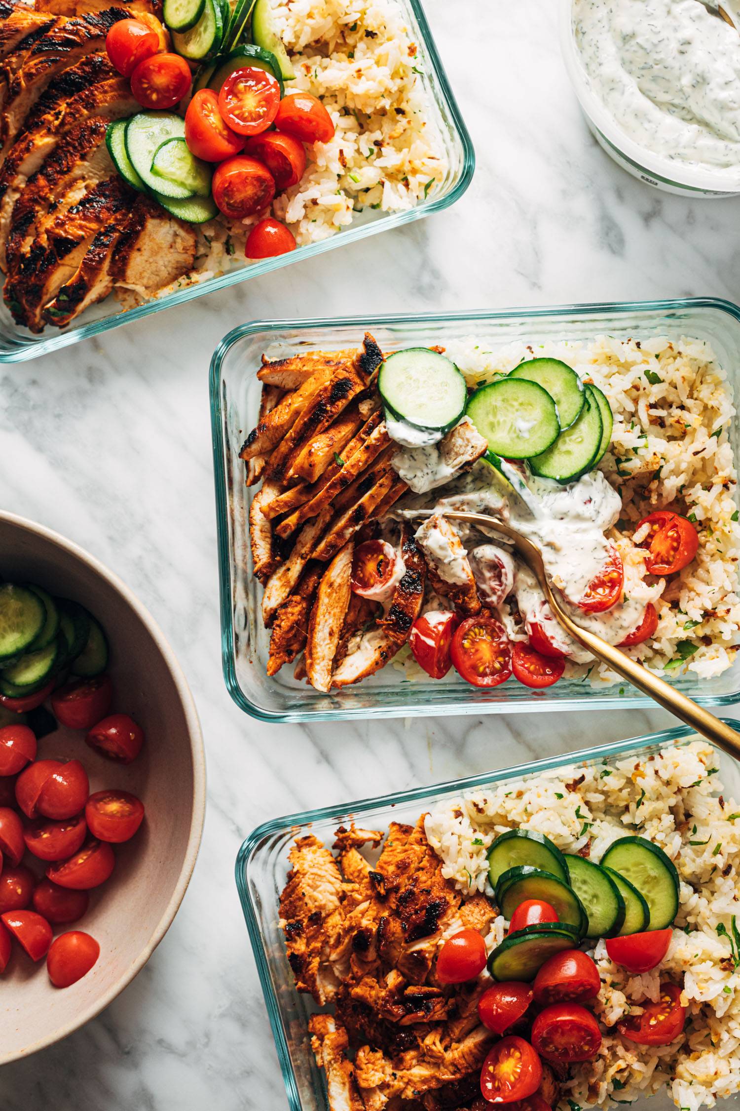 Buffalo chicken bowls in meal prep containers.