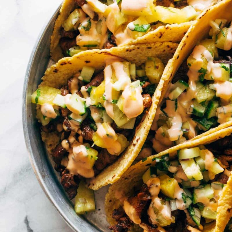 A picture of Caramelized Pork Tacos with Pineapple Salsa