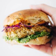 Spicy Cauliflower Burger held by hand.