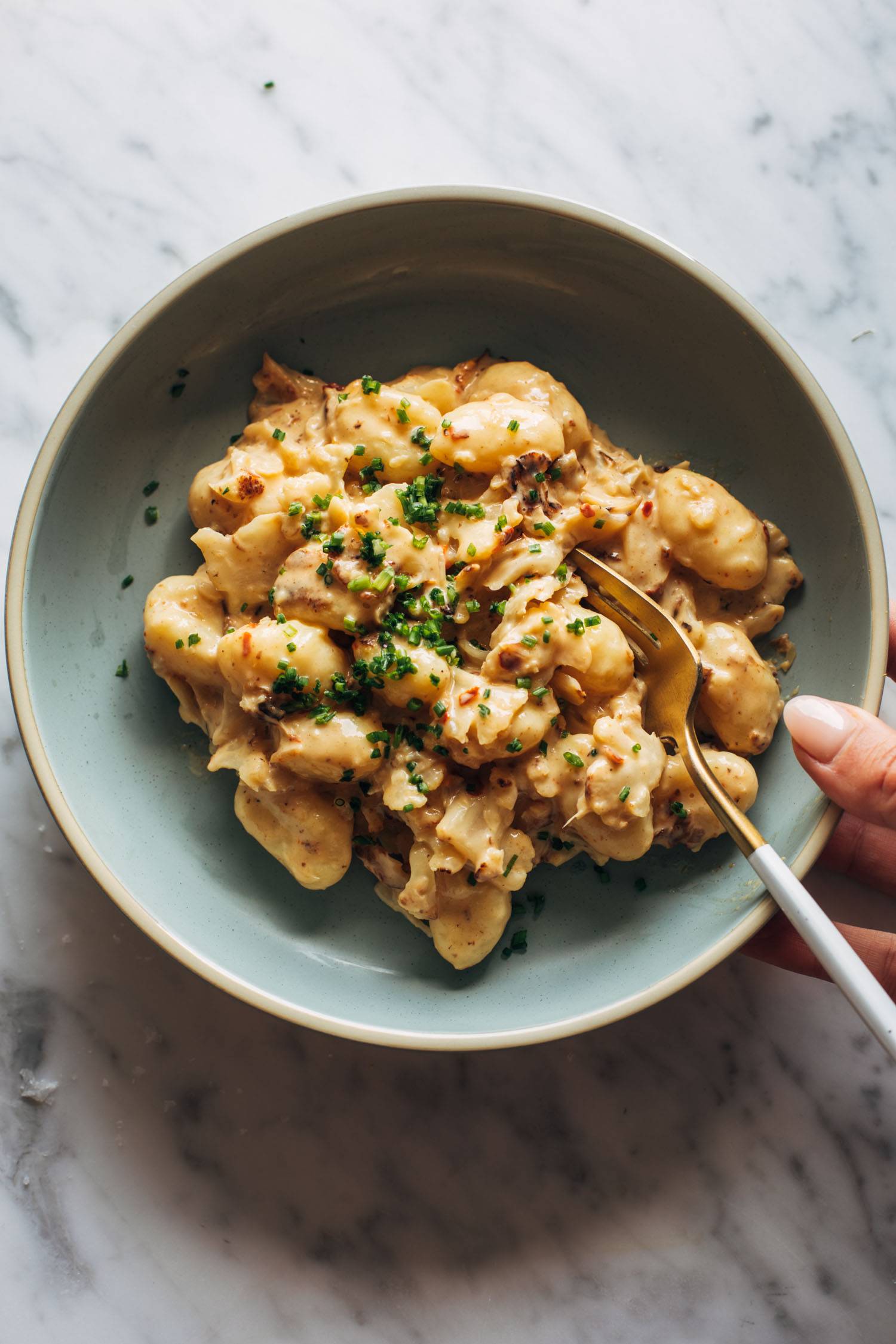 Cauliflower orange gnocchi in a bowl.