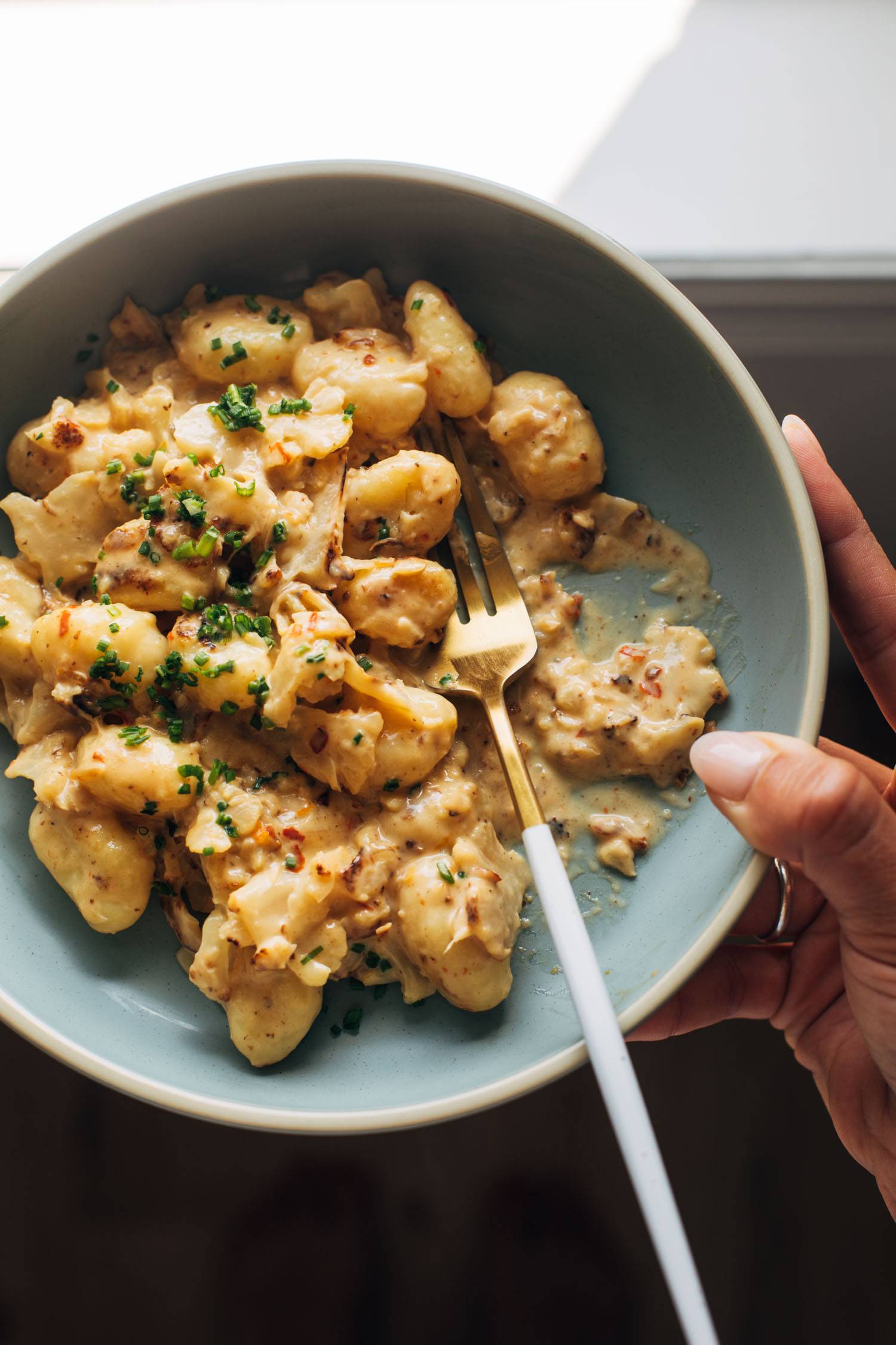 Cauliflower orange gnocchi in a bowl.