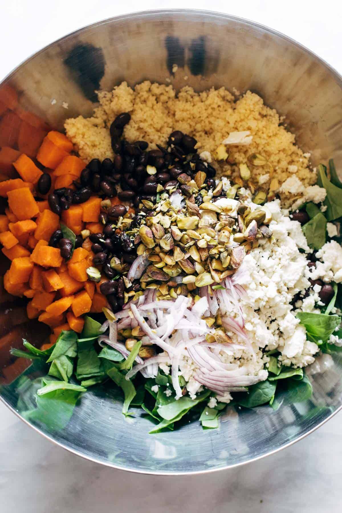 Couscous salad in a bowl before mixing.