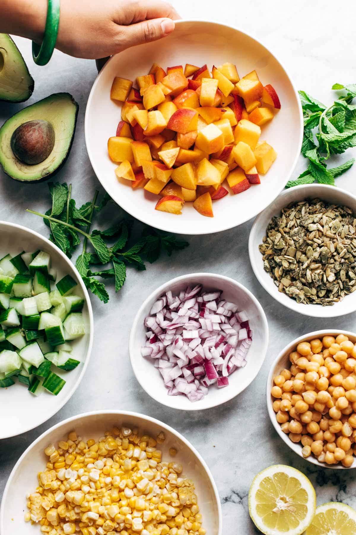 Ingredients for couscous summer salad in bowls.