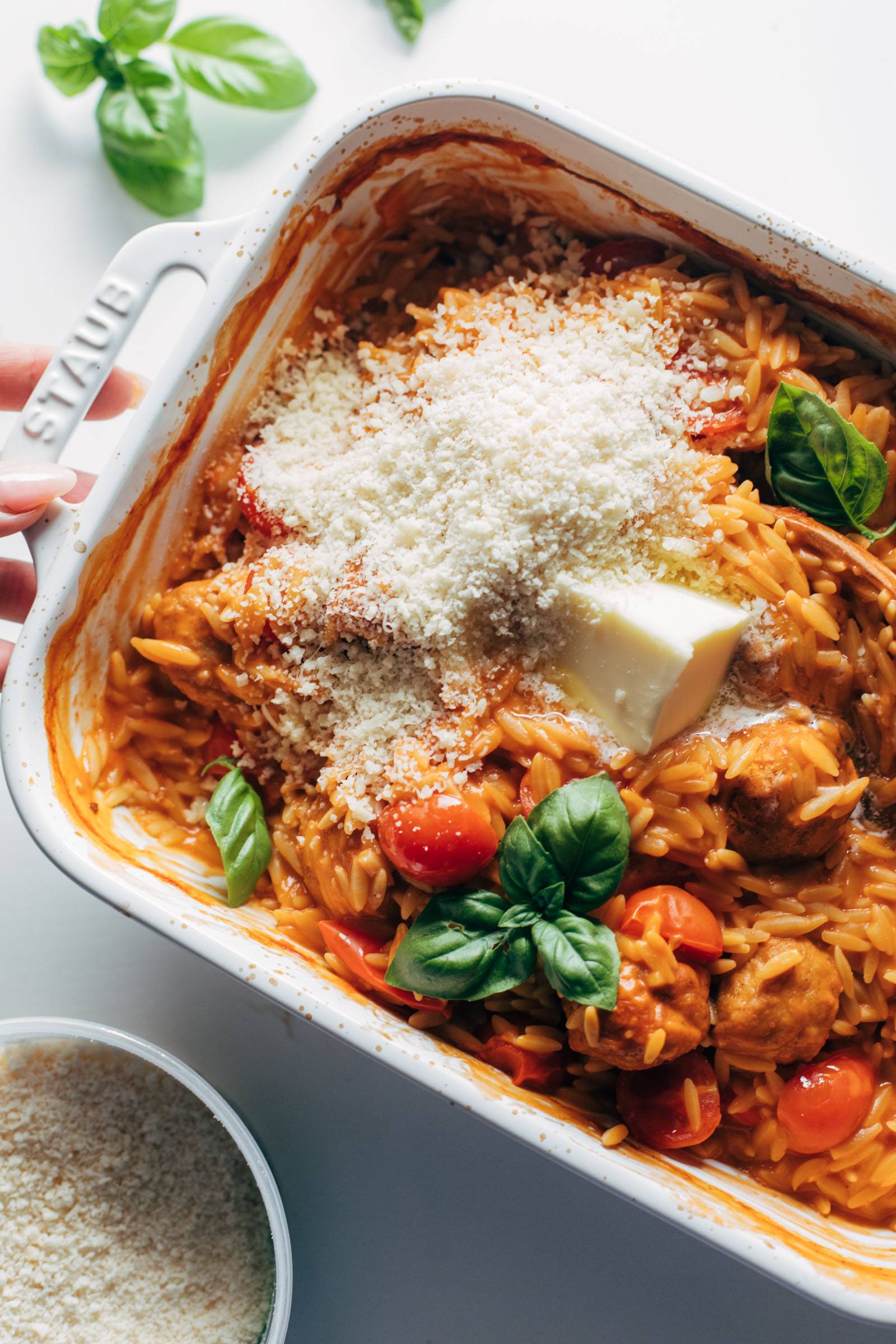 Butter and cheese on top of baked orzo