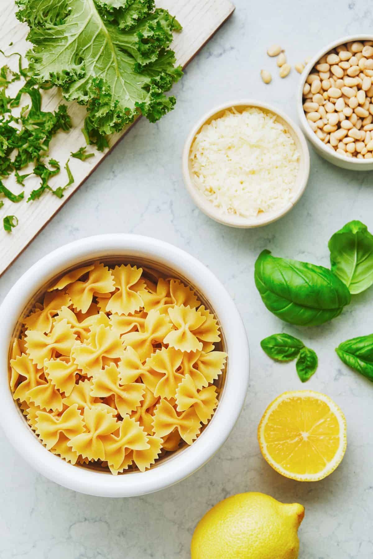 Ingredients for Creamy Kale Pasta in bowls.