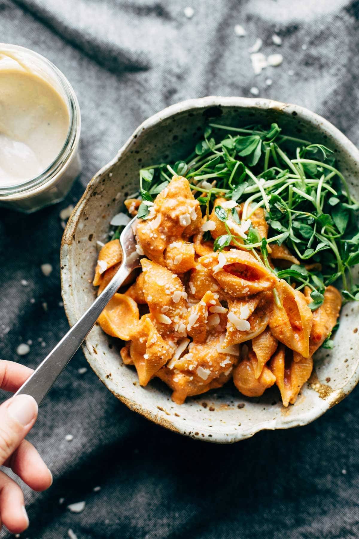 Three Ingredient Creamy Tomato Shells in a bowl with a fork.