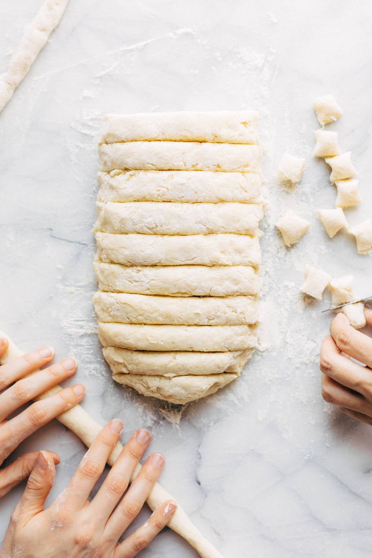 Cutting, rolling, and shaping gnocchi dough.