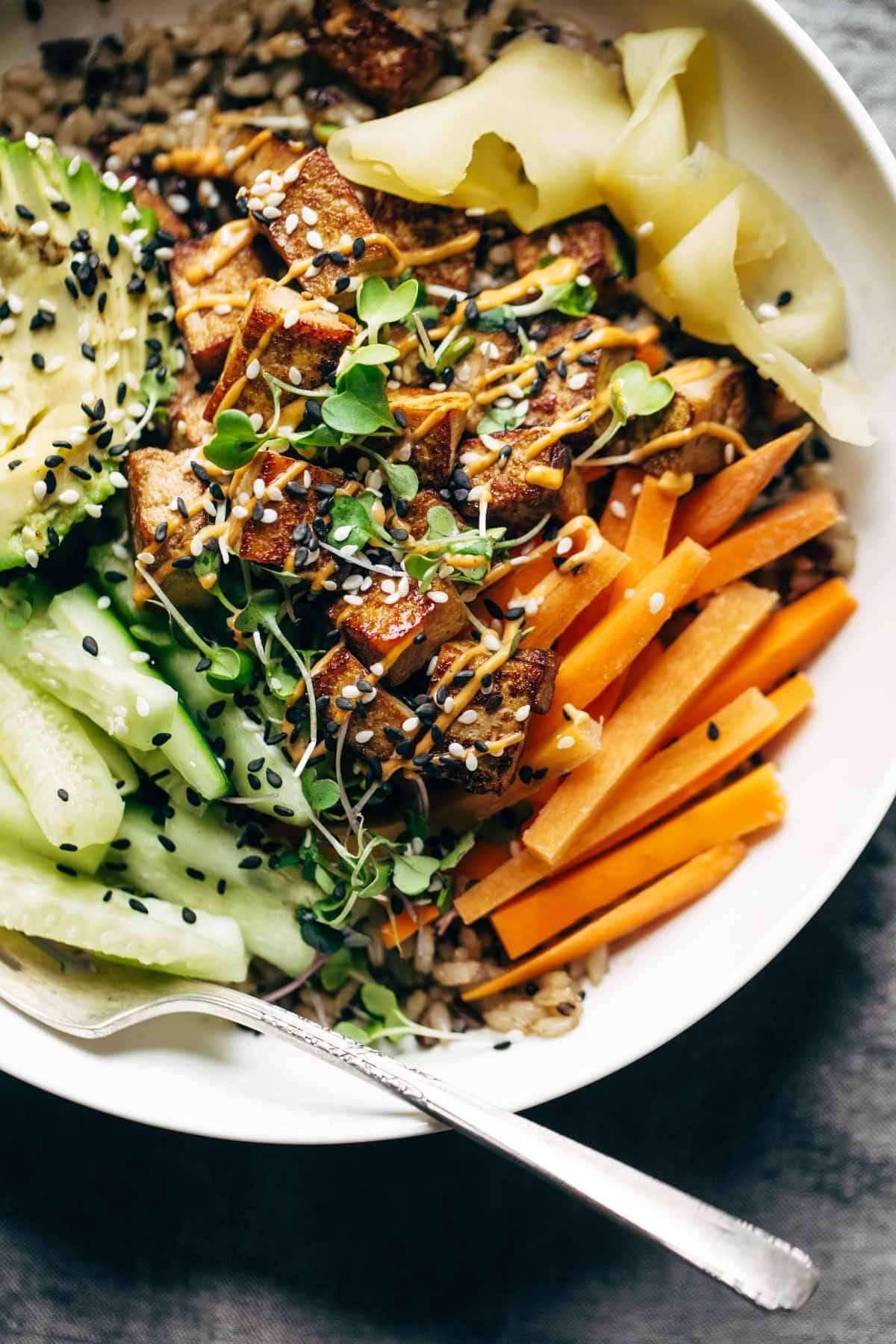 Sushi bowl close up with a fork.