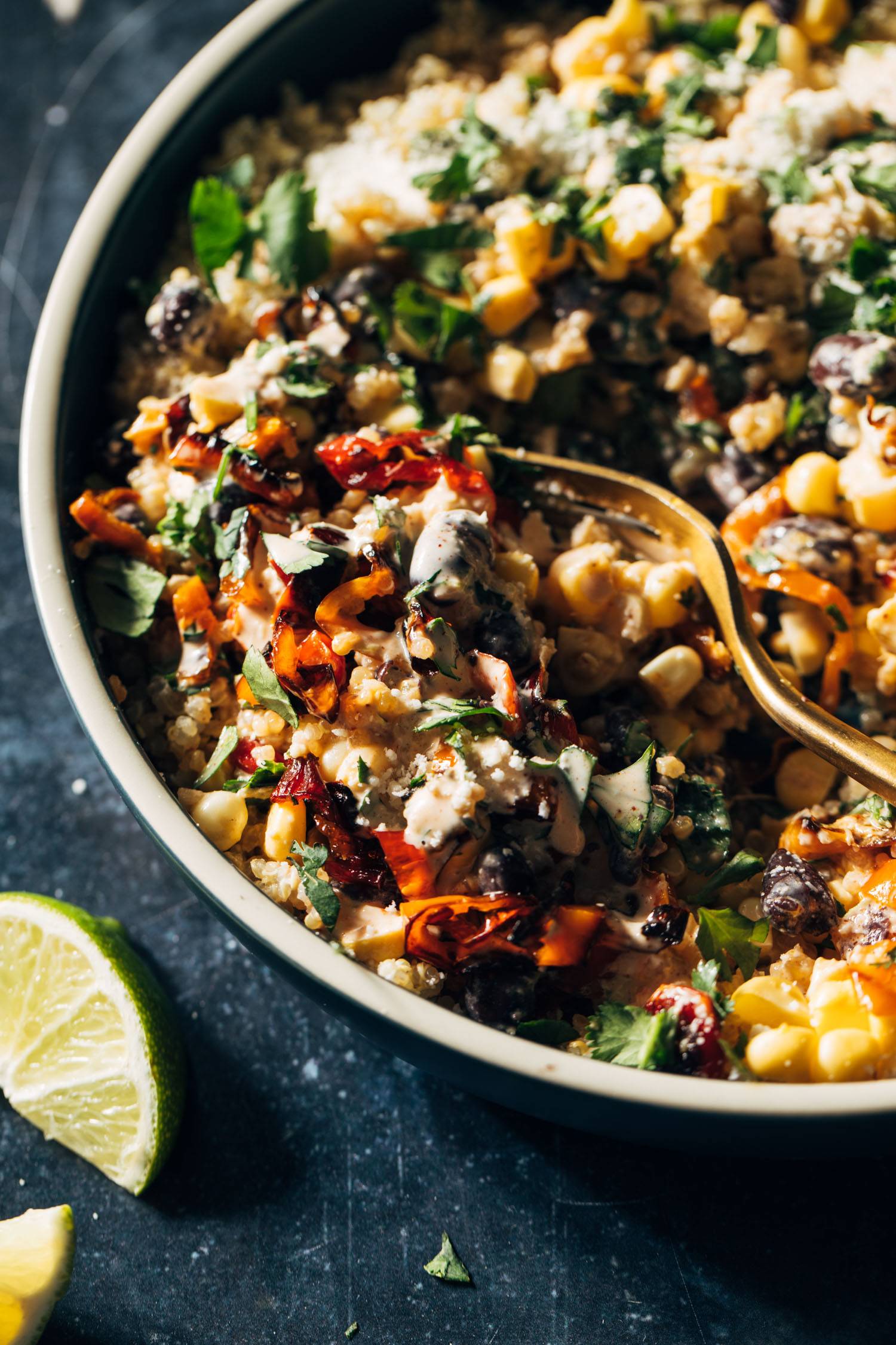 Elote quinoa salad in a bowl with a fork