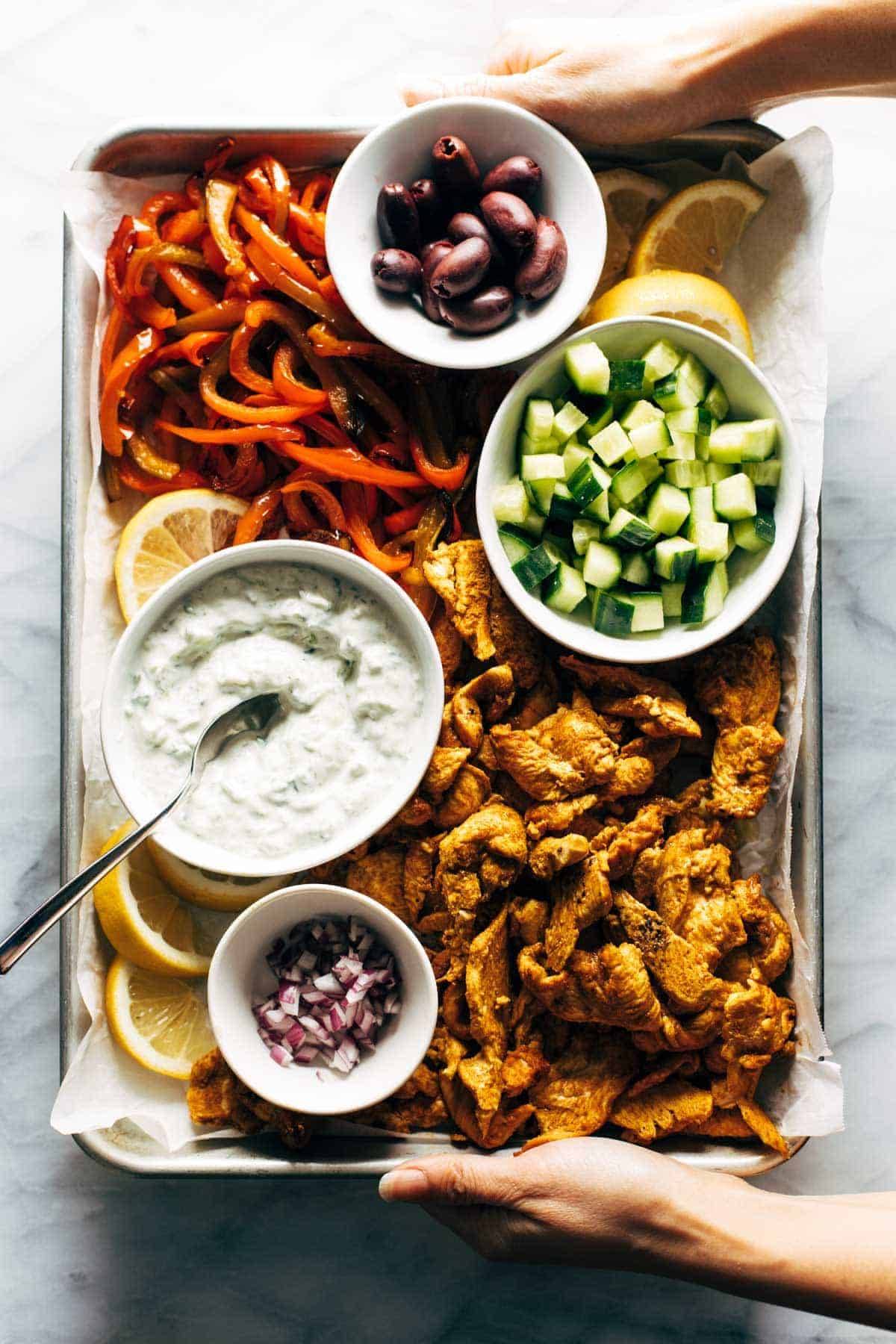 Sheet pan chicken pitas served on a sheet pan.