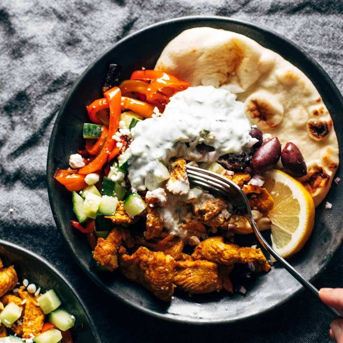 Meat and veggies with tzatziki and a pita.