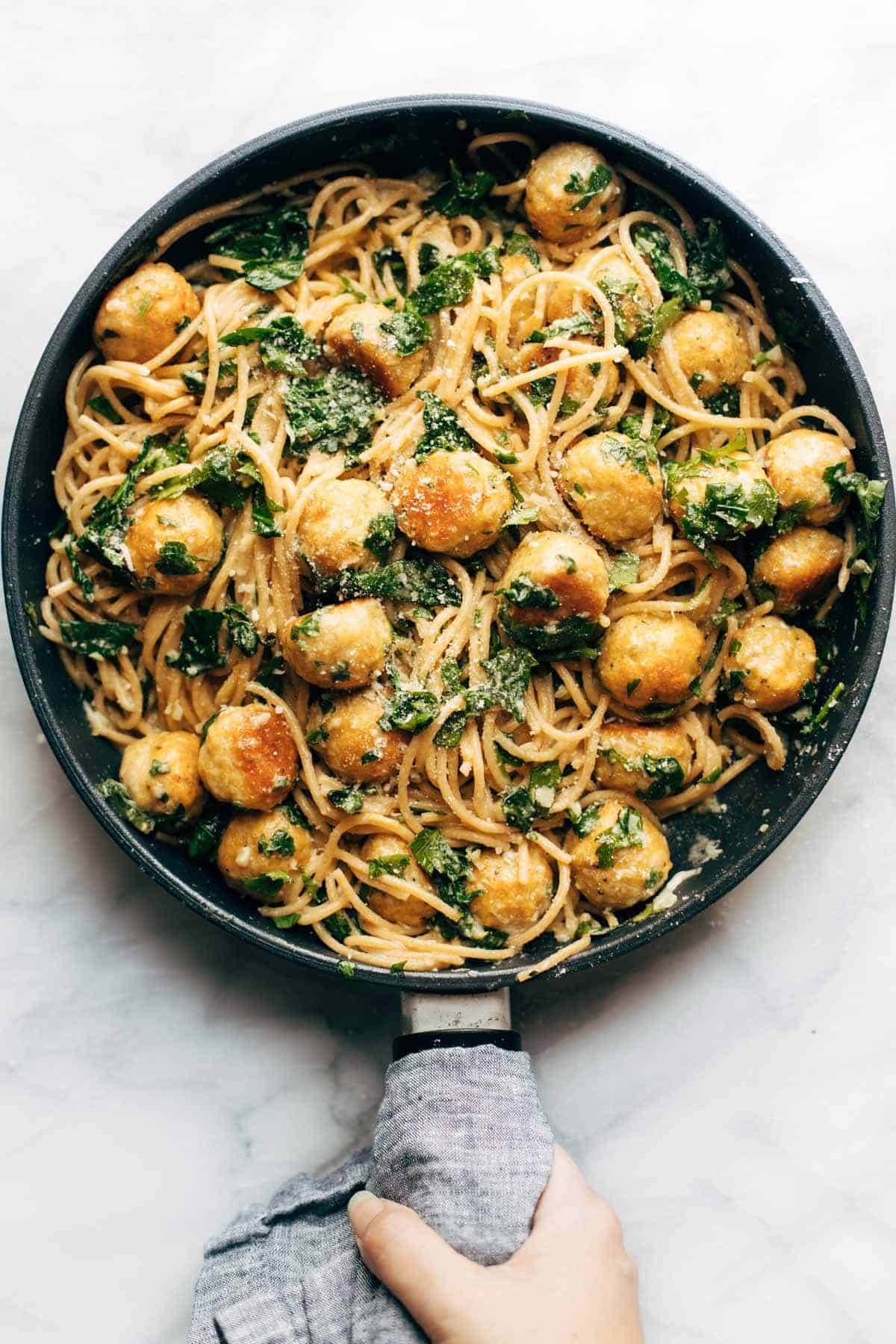 Garlic Herb Spaghetti with Baked Chicken Meatballs in a pan.