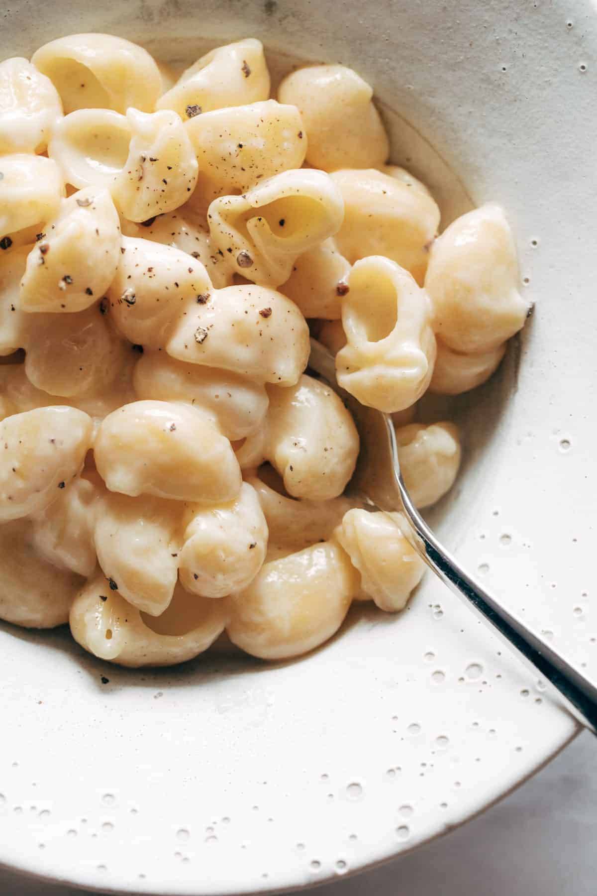 Garlic Parmesan pasta in a bowl with a spoon.