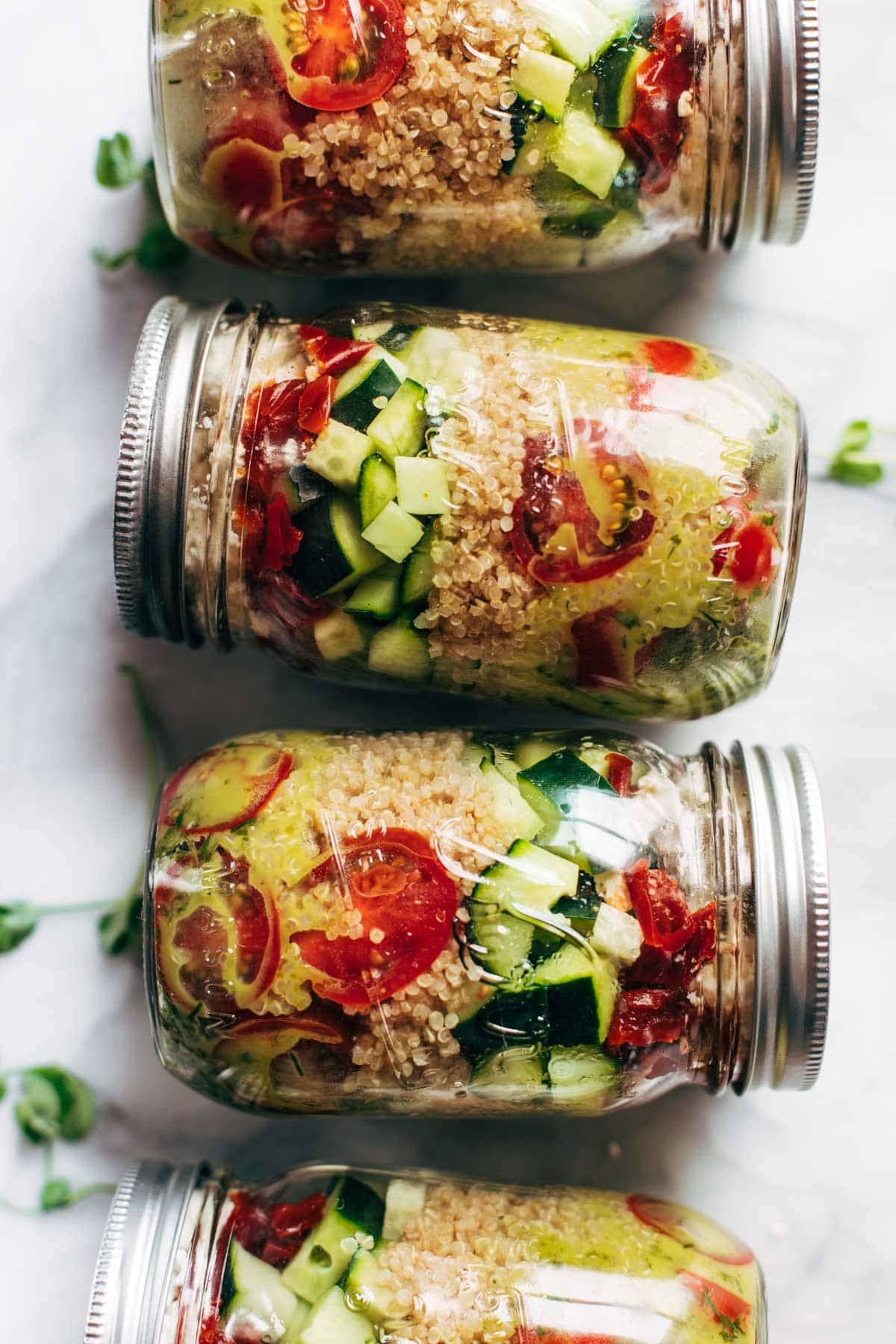 Summer Quinoa Salad in mason jars for meal prep.