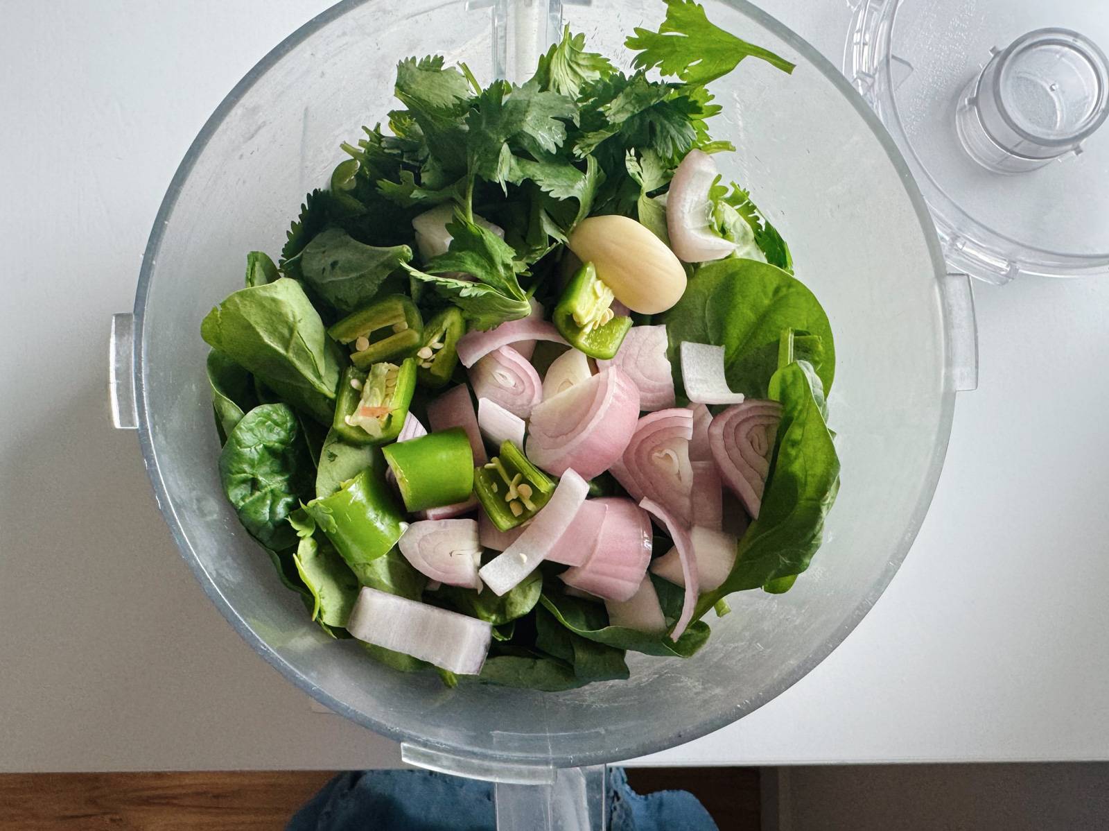 Herbs, shallots, and peppers for Green Rice in food processor