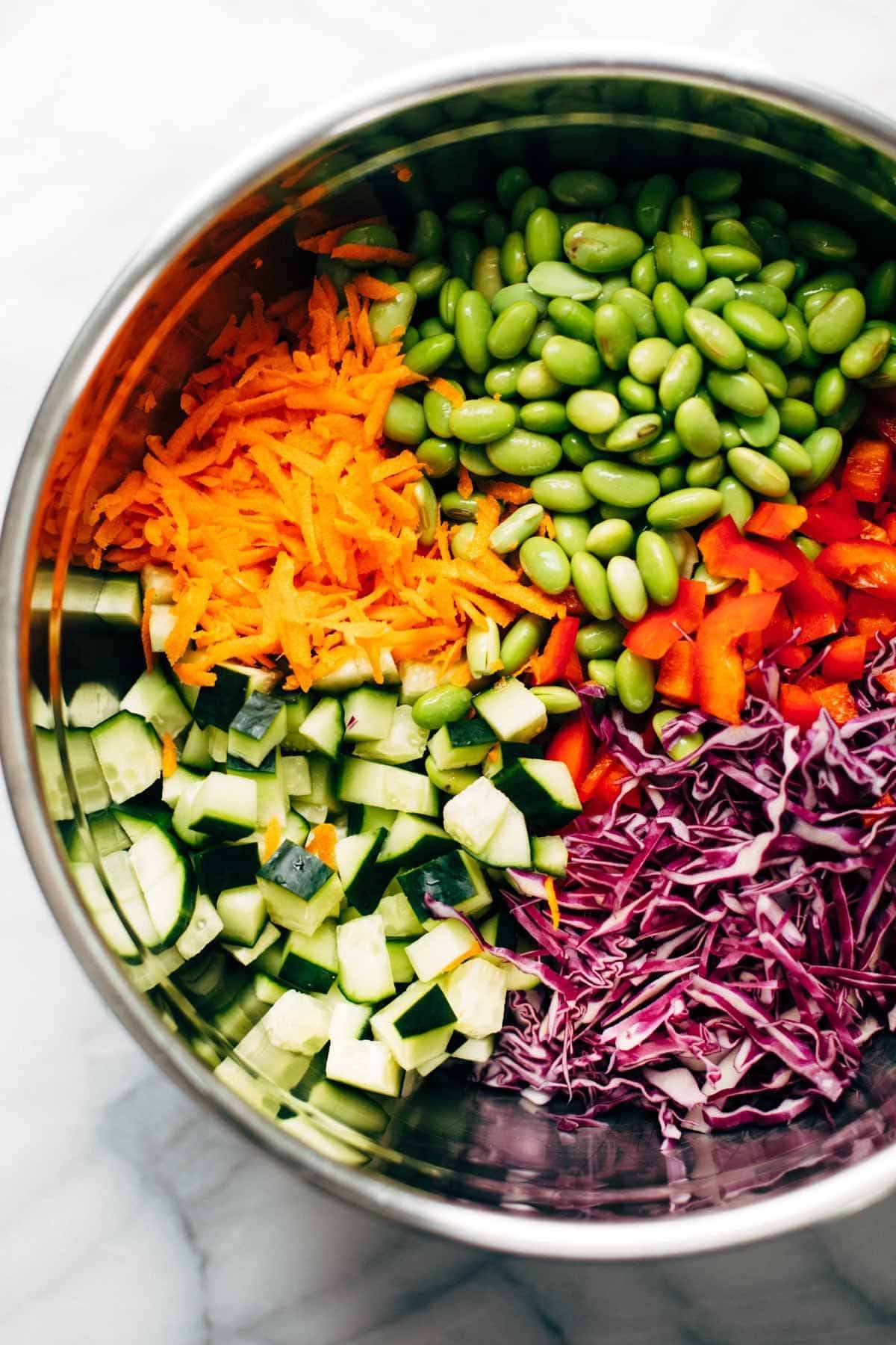 Ingredients for Quinoa Crunch Salad in a mixing bowl.