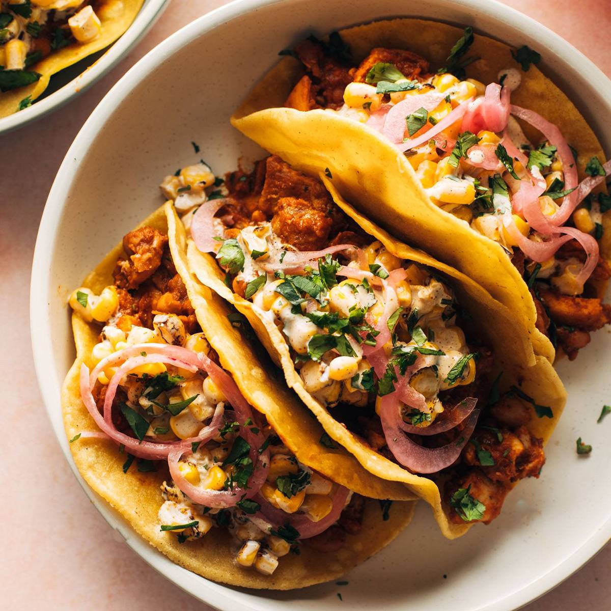 Red chile chicken tacos on a plate