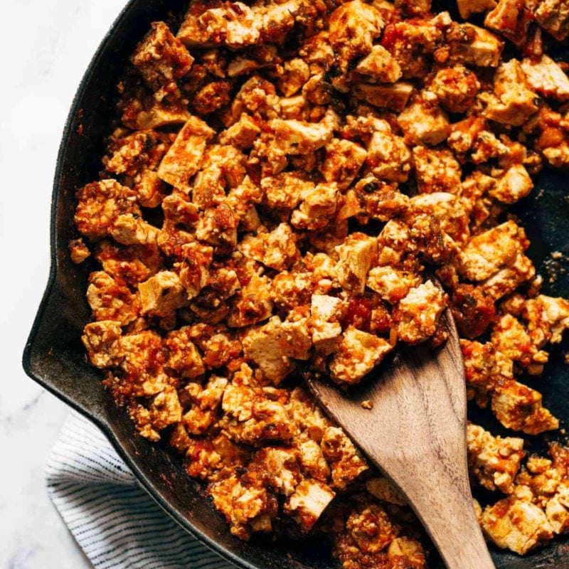 Sofritas in a skillet with a wooden spoon