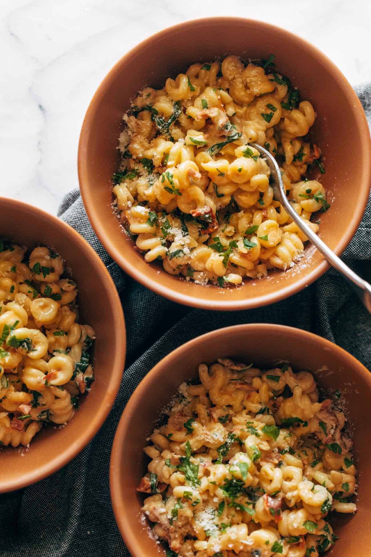 Sun-dried tomato pasta in bowls