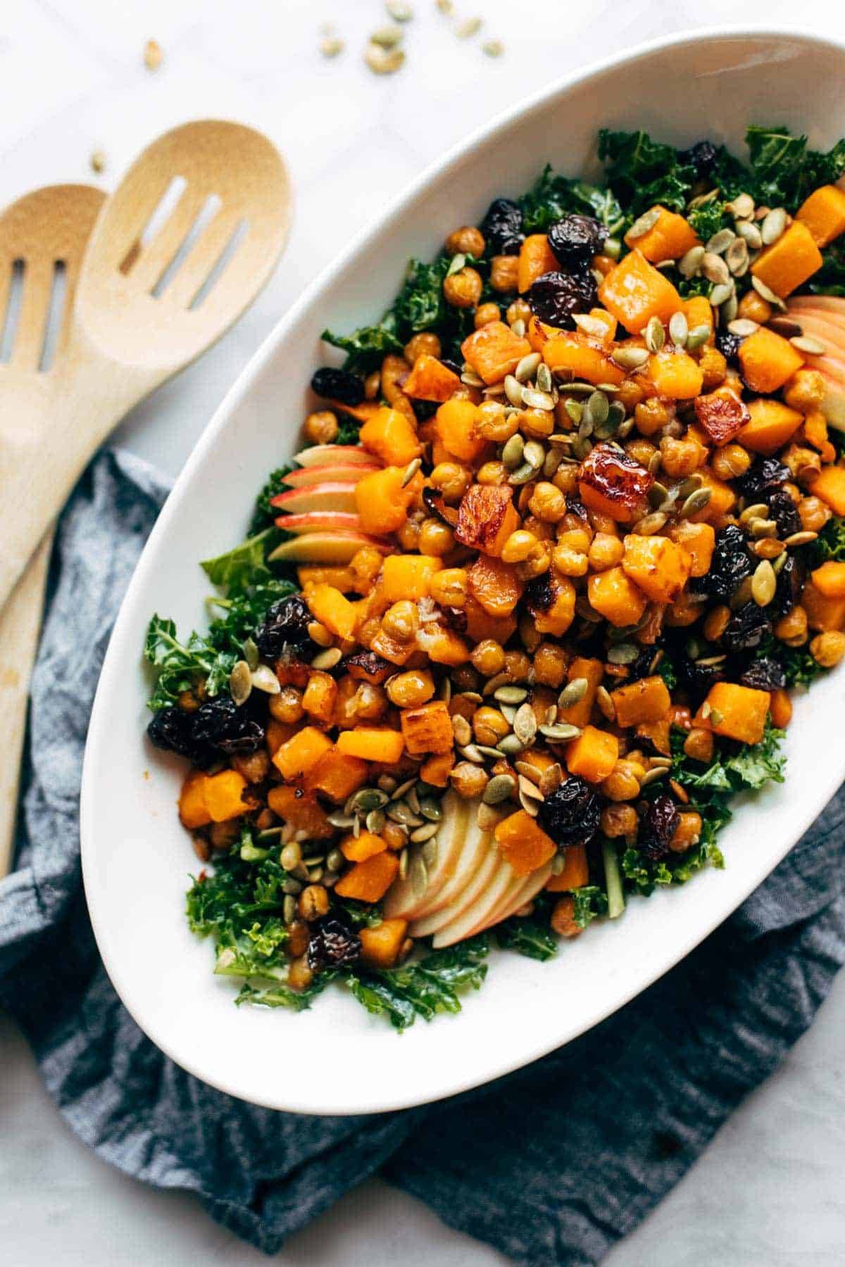 Squash salad in a bowl with toppings.