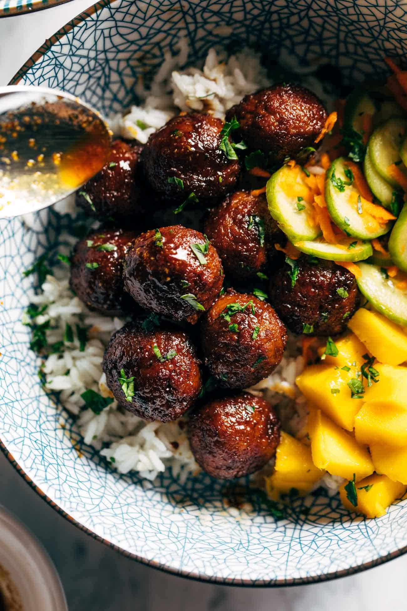 Sticky ginger rice bowls with pickled veg and mango in a bowl