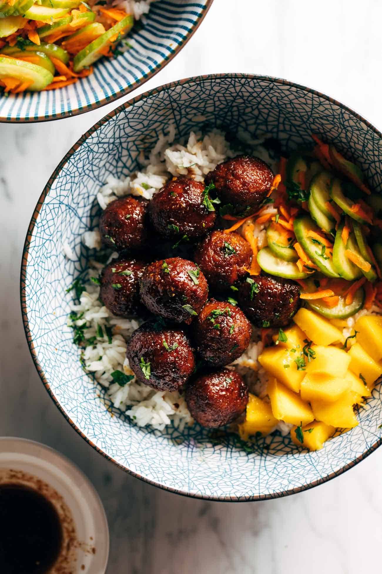 Sticky ginger rice bowls with pickled veg and mango in a bowl