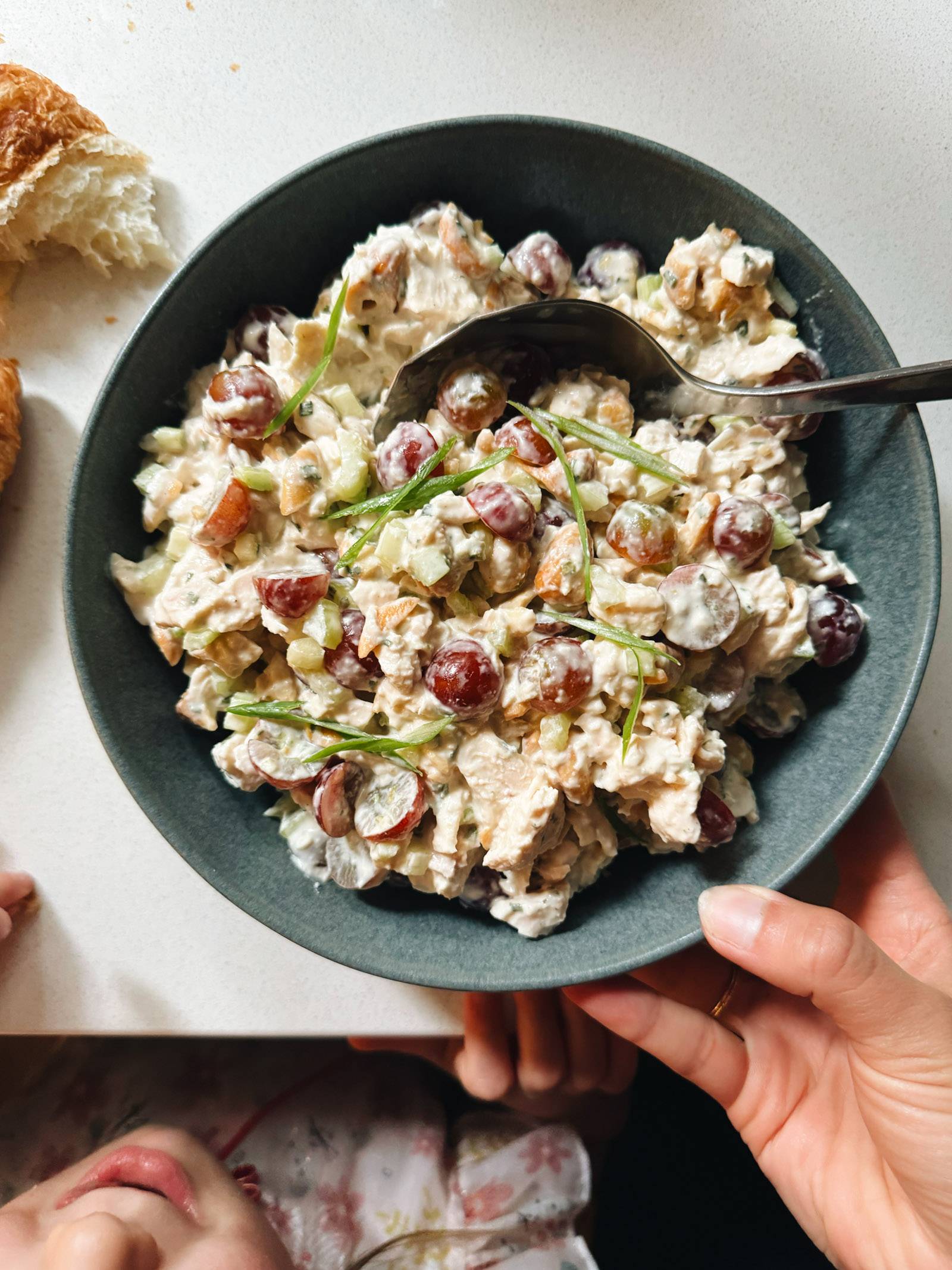 Chicken salad in a bowl with a spoon.