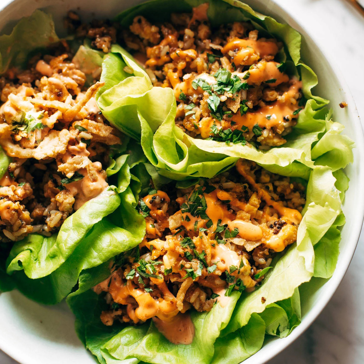 Tofu lettuce wraps on a plate.