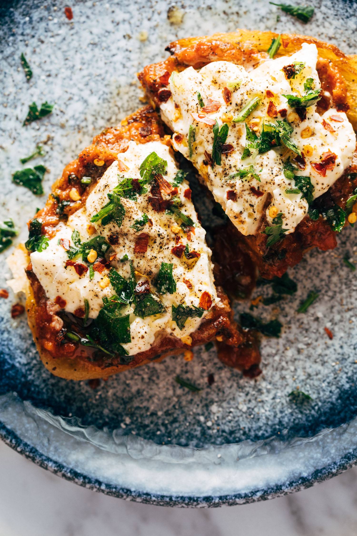 Zaalouk toast on a plate with herbs