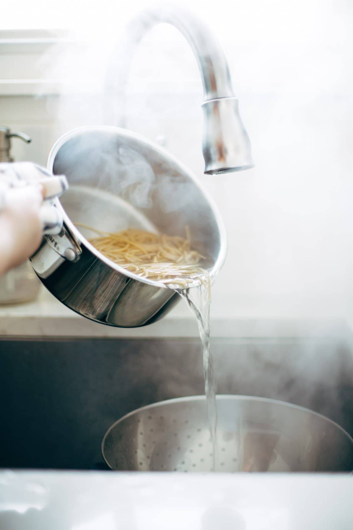 Noodles steaming in a sink.