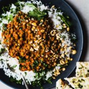 Red curry lentils on a plate with rice.